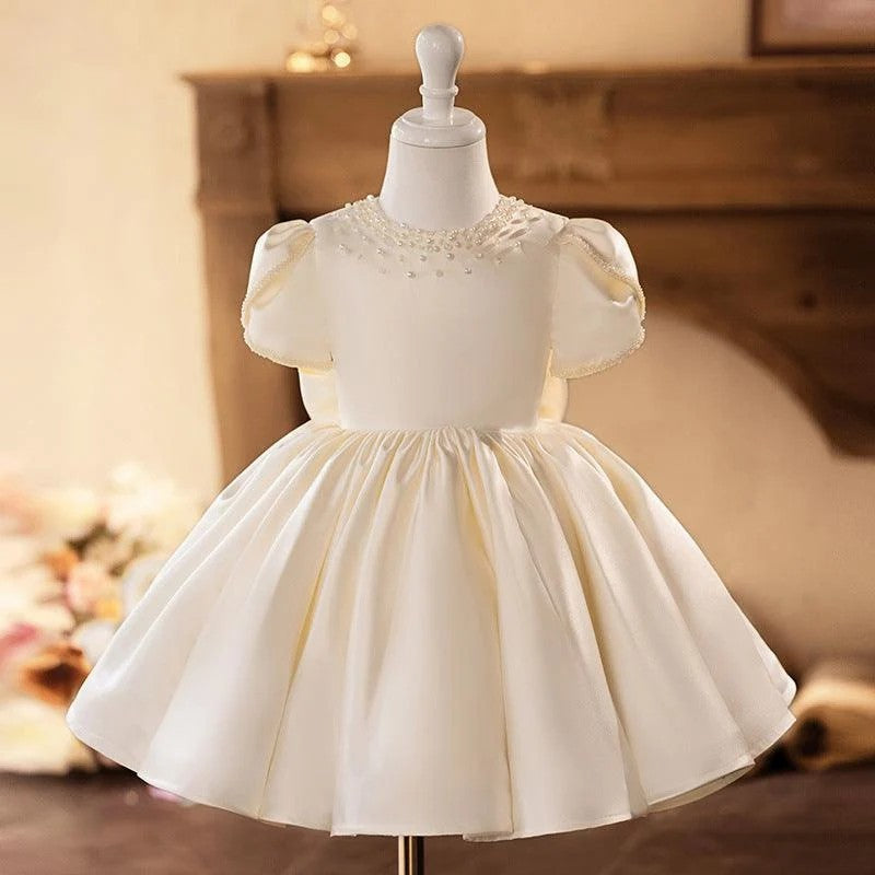 TinyTulle Elegant Ivory Satin Baby Girl Dress with Pearl Beaded Neckline for First Communion