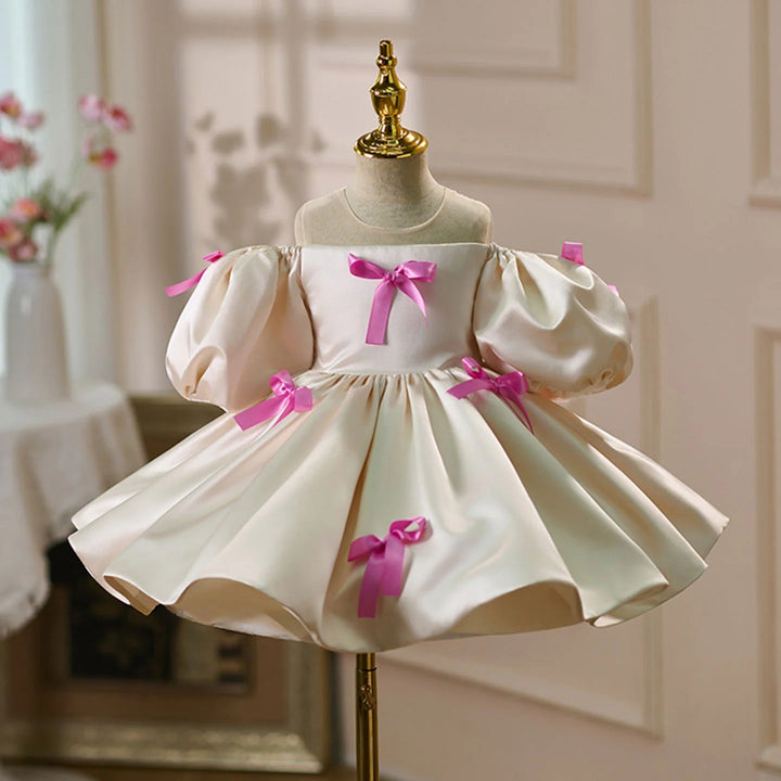 TinyTulle Ivory Satin Puff Sleeve Flower Girl Dress with Pink Bow Accents