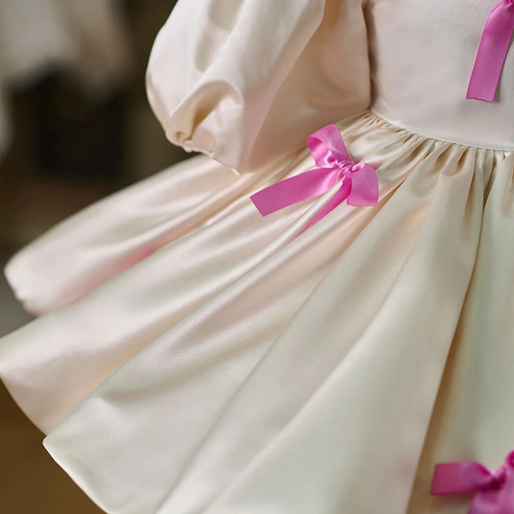 TinyTulle Ivory Satin Puff Sleeve Flower Girl Dress with Pink Bow Accents