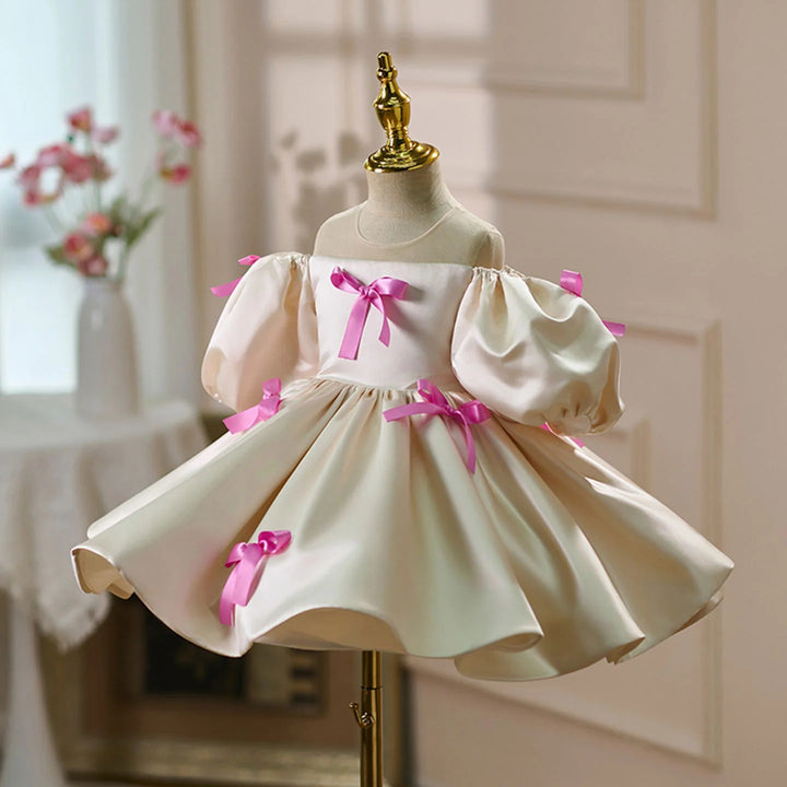 TinyTulle Ivory Satin Puff Sleeve Flower Girl Dress with Pink Bow Accents