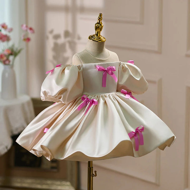 TinyTulle Ivory Satin Puff Sleeve Flower Girl Dress with Pink Bow Accents