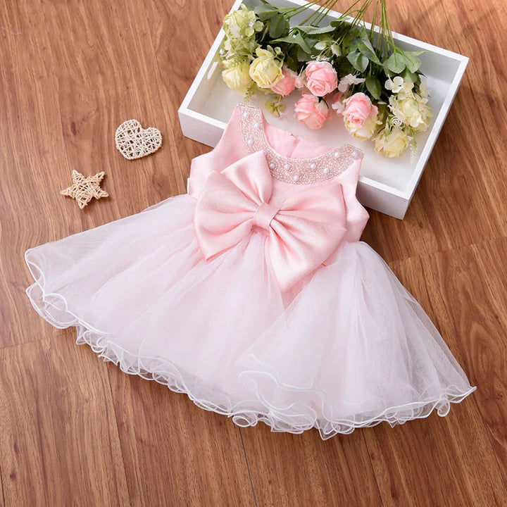 TinyTulle Pink Satin Bow White Tulle Flower Girl Dress with Beaded Details